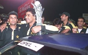 Waqar Younis and Moin Khan stand proudly near the car that Waqar walked away with at Sharjah, Pakistan v South Africa, Coca-Cola Cup 1999/00, Final, Sharjah C.A. Stadium, 31 March 2000. ©ESPNcricinfo Ltd